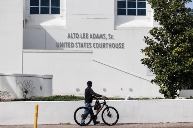 A person walks past the Alto Lee Adams Sr. US Courthouse as the sentencing hearing of Ryan Routh takes place in Fort Pierce, Florida, USA, 04 February 2026. (EPA)