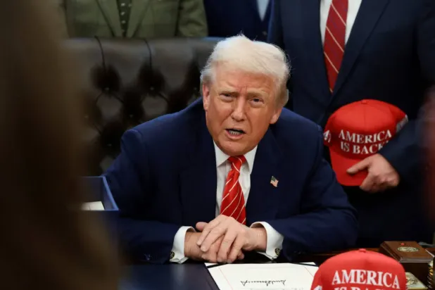 US President Donald Trump speaks to reporters at the White House in Washington (Reuters)