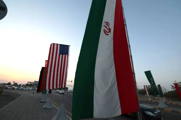 The flags of USA and Iran are displayed in Muscat, Oman, 25 April 2025. EPA/ALI HAIDER
