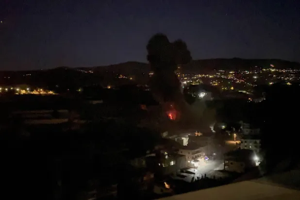 Fire and smoke rises after Israeli airstrikes on Kfar Hatta in southern Lebanon, Lebanon, January 11, 2026. REUTERS/Ali Hankir
