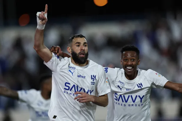 Soccer Football - Saudi Pro League - Al Okhdood v Al Hilal - Prince Hathloul Bin Absulaziz Sport City Stadium, Najran, Saudi Arabia - February 5, 2026  Al Hilal's Karim Benzema celebrates scoring their first goal with Nasser Al Dawsari REUTERS/Hamad I Mohammed
