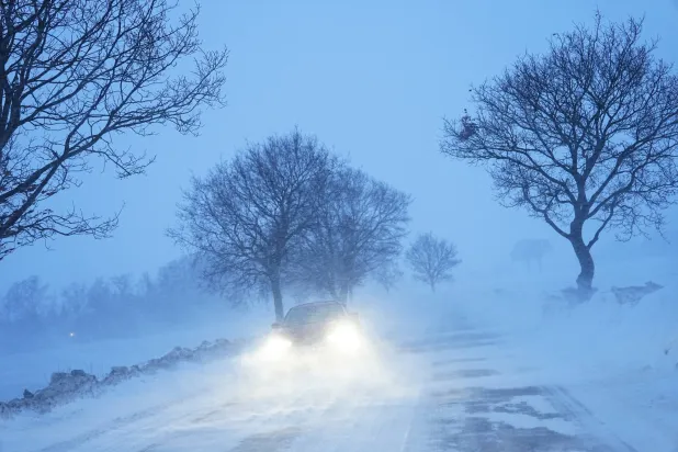 A car drives in heavy snow at Store Heddinge in South Zealand, Denmark, 05 February 2026.  EPA/Mads Claus Rasmussen
