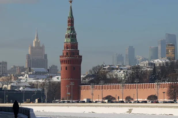 A person walks along an embankment of the Moskva River near the Kremlin wall in Moscow, Russia February 5, 2026. REUTERS/Anastasia Barashkova