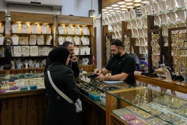 Meanwhile, many Lebanese are crowding marketplaces to buy gold and silver in hopes of recovering some of their losses. (AP)
