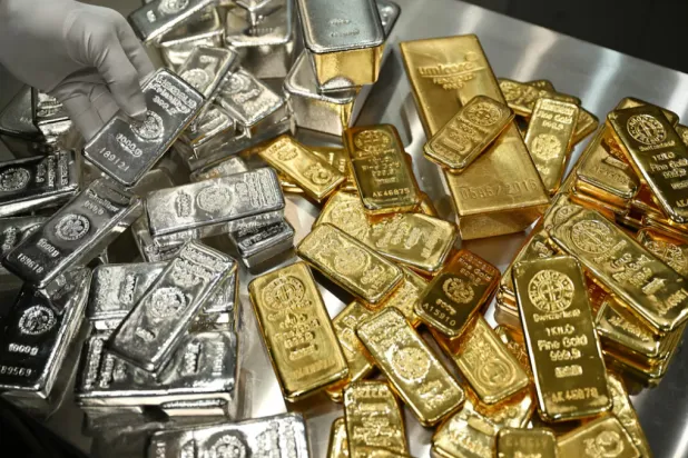 Gold and silver bars are stacked in the safe deposit boxes room of the Pro Aurum gold house in Munich, Germany, January 10, 2025. REUTERS/Angelika Warmuth 
