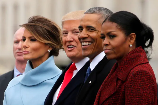 FILE PHOTO: US President Donald Trump and first lady Melania Trump see off former US President Barack Obama and his wife Michelle Obama as they depart following Trump's inauguration at the Capitol in Washington, US January 20, 2017. REUTERS/Jonathan Ernst/File Photo