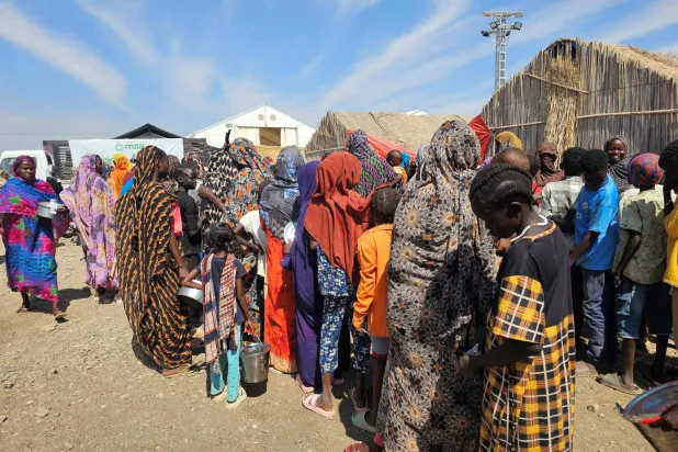 Displaced Sudanese wait to receive humanitarian aid at the Abu al-Naga displacement camp in the Gedaref State, some 420km east of the capital Khartoum on February 6, 2026. (AFP)