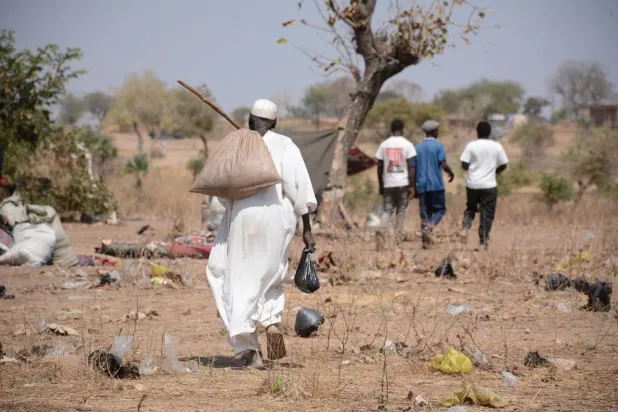  An elderly man picks up his food aid ration at the Umdulu Camp, in Engpung County, Sudan, January 30, 2026. (Karl Schembri/Norweigan Refugee Council/Handout via Reuters)