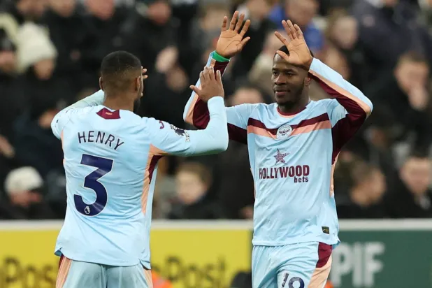 Football - Premier League - Newcastle United v Brentford - St James' Park, Newcastle, Britain - February 7, 2026 Brentford's Dango Ouattara celebrates scoring their third goal with Brentford's Rico Henry. (Reuters)
