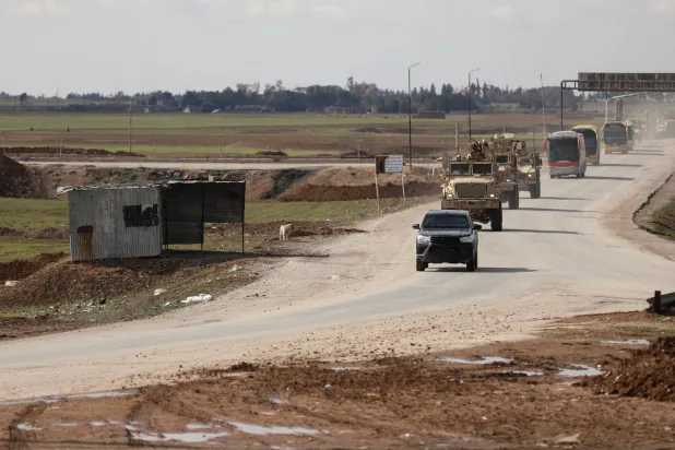 Vehicles transporting ISIS detainees by the US military, according to a security source from the Syrian Democratic Forces, head from Syria towards Iraq, in Qamishli, Syria, February 8, 2026. (Reuters)