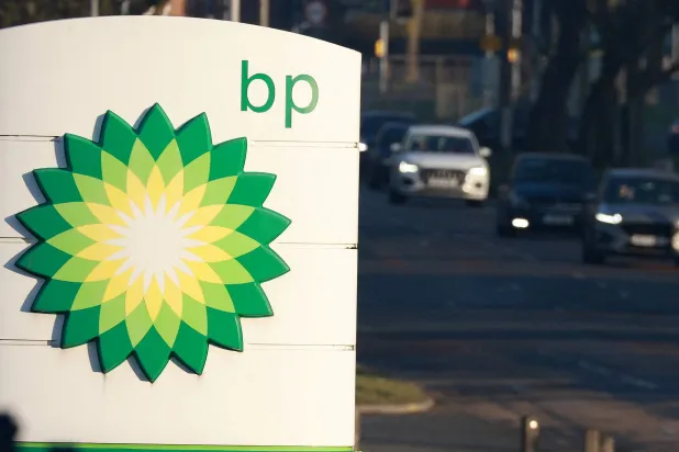 FILE PHOTO: Vehicles drive past a BP (British Petroleum) petrol station in Liverpool, Britain, February 7, 2023. REUTERS/Phil Noble/File Photo
