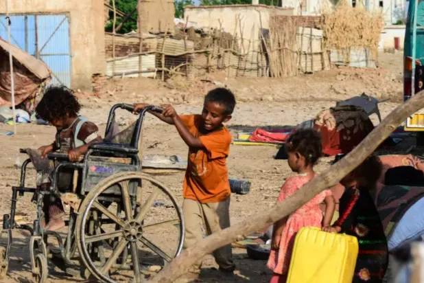 Sudanese children play on a street in Tokar, in Red Sea State, following heavy flooding in October, 2024 © AFP/File
