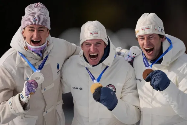 Silver medalist Eric Perrot, of France, from left, gold medalist Johan-Olav Botn, of Norway, and bronze medalist Sturla Holm Laegreid, of Norway, pose after the men's 20-kilometer individual biathlon race at the 2026 Winter Olympics in Anterselva, Italy, Tuesday, Feb. 10, 2026. (AP)