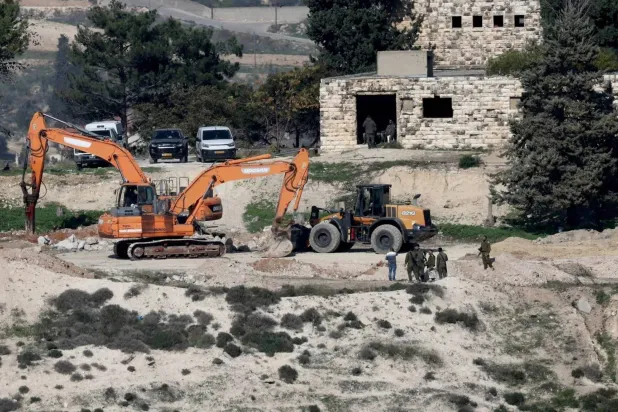 Israeli machinery levels land ahead of settlement construction near Jenin in the occupied West Bank, Dec. 23, 2025 (EPA)