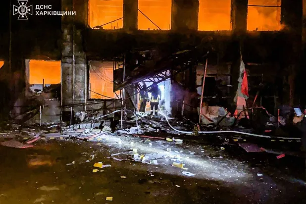 In this photo provided by the Ukrainian Emergency Service, emergency services personnel work to extinguish a fire at a house following a Russian air attack in Barvinkove, Kharkiv region, Ukraine, Wednesday, Feb. 11, 2026. (Ukrainian Emergency Service via AP)