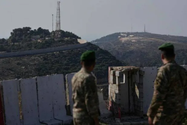 Two Lebanese army soldiers at a military border post with Israel in the village of Alma El Chaab in southern Lebanon (Archive - AP)