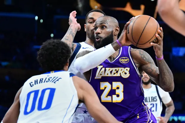 LOS ANGELES, CALIFORNIA - FEBRUARY 12: LeBron James #23 of the Los Angeles Lakers drives against the Dallas Mavericks in the second half at Crypto.com Arena on February 12, 2026 in Los Angeles, California. Wally Skalij/Getty Images/AFP