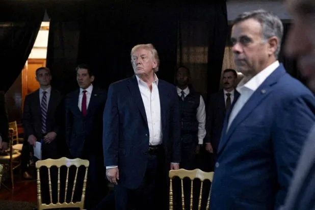 FILE PHOTO: A photograph posted by US President Donald Trump on his Truth Social account shows him standing near CIA Director John Ratcliffe as they watch the US military operation in Venezuela from Trump's Mar a Lago resort, in Palm Beach, Florida, US, January 3, 2026. @realDonaldTrump/Handout via REUTERS/File Photo