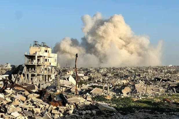 FILE PHOTO: Smoke rises following an explosion, within the "yellow line" zone, which is controlled by Israel, in Khan Younis in the southern Gaza Strip, February 10, 2026. Picture taken with a phone. REUTERS/Haseeb Alwazeer/File Photo
