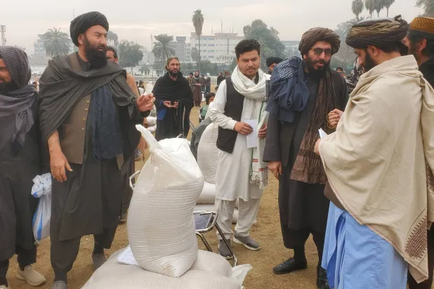 Afghan families receive food rations for the coming holy month of Ramadan in Jalalabad, Nangarhar province, Afghanistan, 09 February 2026. (EPA)