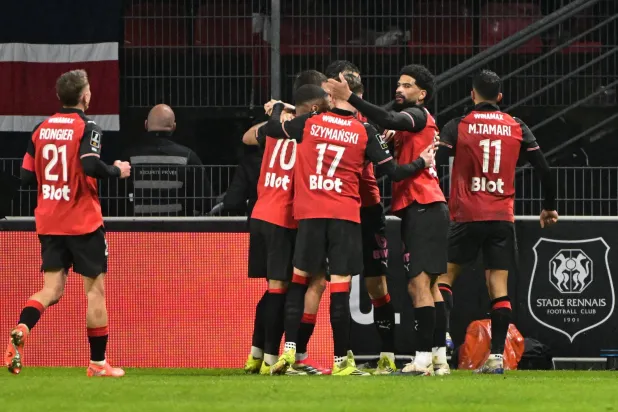 Rennes' Jordanian forward #11 Mousa Tamari (R) celebrates scoring his team's first goal during the French L1 football match between Stade Rennais FC and Paris Saint-Germain (PSG) at the Roazhon Park stadium in Rennes, western France, on February 13, 2026. (Photo by Damien MEYER / AFP)