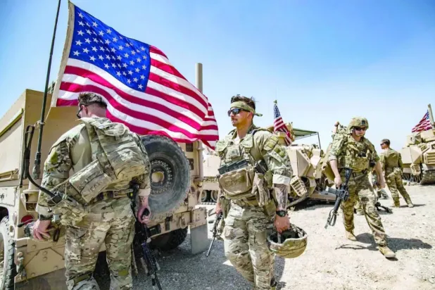 US soldiers patrol the countryside of Rumaylan in Syria's northeastern Hasakeh province on June 7, 2023. (AFP) 