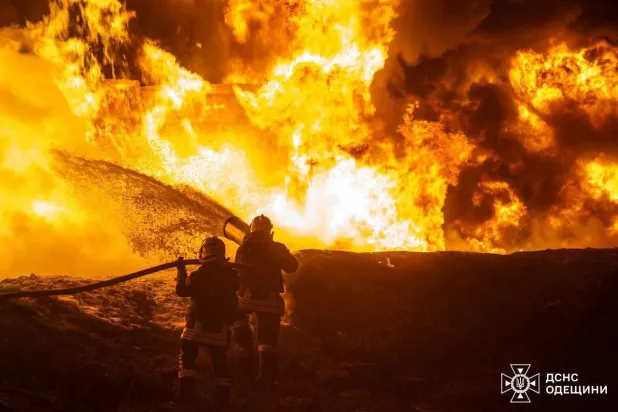 This photograph taken and released by Ukrainian Emergency Services on February 15, 2026 shows firefighters extinguishing a fire after a Russian drone strike in Odessa, amid the Russian invasion of Ukraine. (Handout / Ukrainian Emergency Service / AFP)