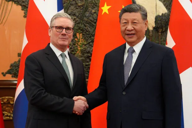 Britain's Prime Minister Keir Starmer shakes hands with Chinese President Xi Jinping, ahead of a bilateral meeting in Beijing, China, January 29, 2026. Carl Court/Pool via REUTERS 
