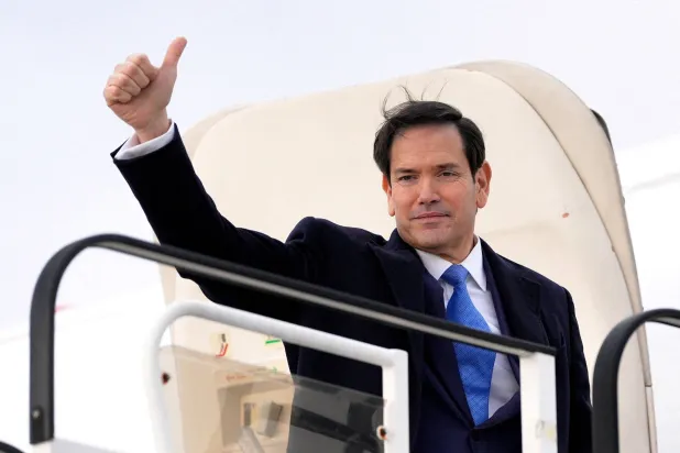 US Secretary of State Marco Rubio gives a thumbs-up as he boards a plane while departing Bratislava Airport in Bratislava, Slovakia, Sunday, Feb. 15, 2026. (Reuters)