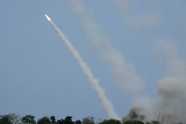 A US M142 High Mobility Artillery Rocket System (HIMARS) fires a missile during a Combined Joint Littoral Live Fire Exercise at the joint military exercise called "Balikatan", Tagalog for shoulder-to-shoulder in a Naval station in Zambales province, northern Philippines on Wednesday, April 26, 2023. (AP)