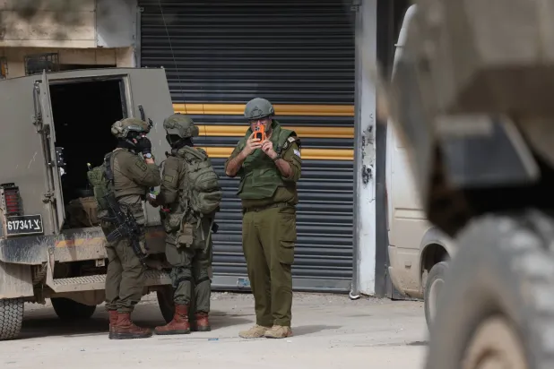 Israeli troops conduct a military raid in the village of Al-Yamoun, west of Jenin, West Bank, 17 February 2026. (EPA)