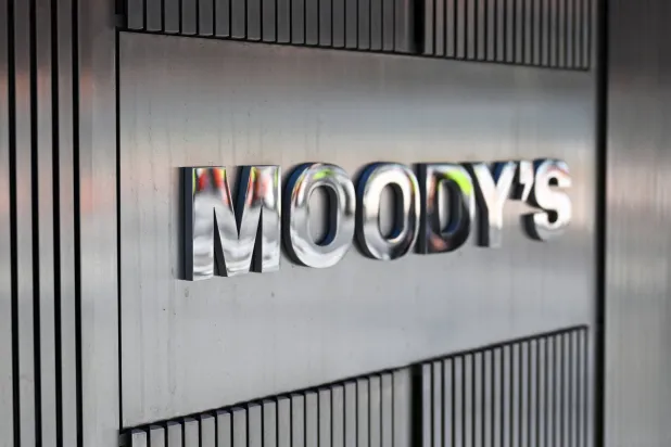 (FILES) Signage for Moody's Corporation is displayed at their headquarters at 7 World Trade Center on March 18, 2025 in New York City. (Photo by ANGELA WEISS / AFP)