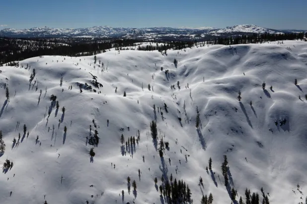 FILE PHOTO: The snow-covered Sierra Nevada Mountains are seen from the air during a Pacific Gas and Electric snowpack survey near Nevada City, California, US April 3, 2017.  REUTERS/Bob Strong/File Photo