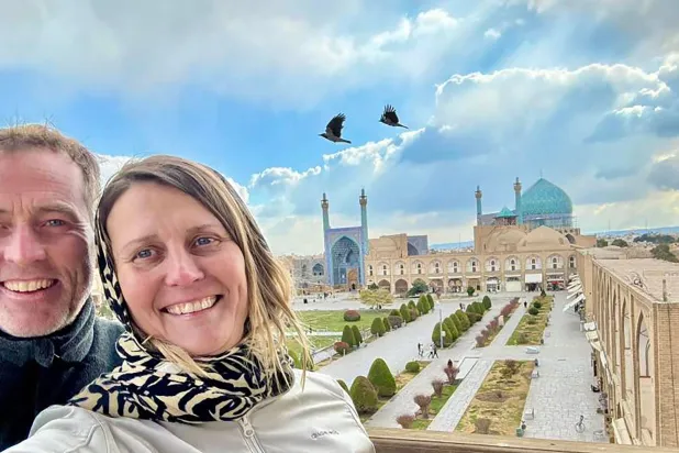 (FILES) A handout photograph released in London on August 4, 2025 by the family of Craig and Lindsay Foreman, shows Craig and Lindsay at Naqsh-e Jahan Square, or Shah Square, with the Shah Mosque in the background, in Isfahan, Iran, at an undated time. (Photo by FAMILY HANDOUT / AFP)