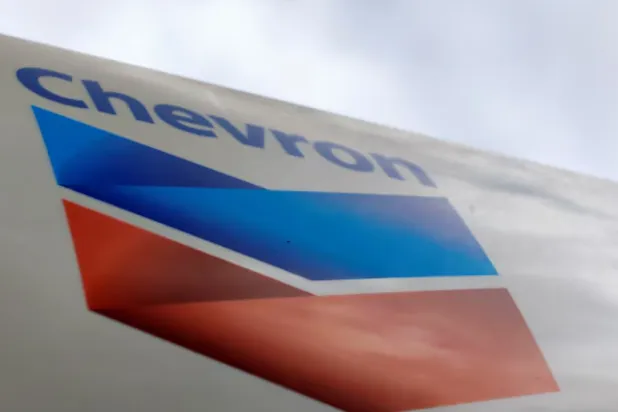 A Chevron gas station sign is pictured at one of their retain gas stations in Cardiff, California October 9, 2013. REUTERS/Mike Blake/File Photo 