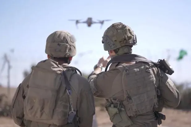 Two Israeli soldiers launch a drone. (Israeli Army)