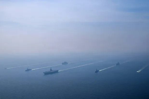 The US Navy's Nimitz-class aircraft carrier USS Abraham Lincoln leads its strike group during a photo exercise in the Arabian Sea, February 6, 2026.  US Navy/Mass Communication Specialist 1st Class Jesse Monford/Handout via REUTERS 