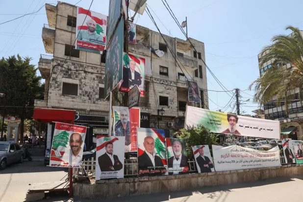 صور لمرشحين للانتخابات البلدية في جنوب لبنان العام الماضي (رويترز)