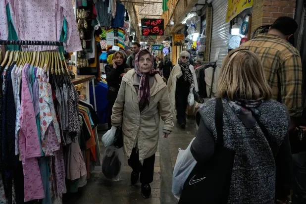  People walk at Tajrish traditional bazaar in northern Tehran, Iran, Thursday, Feb. 19, 2026. (AP) 