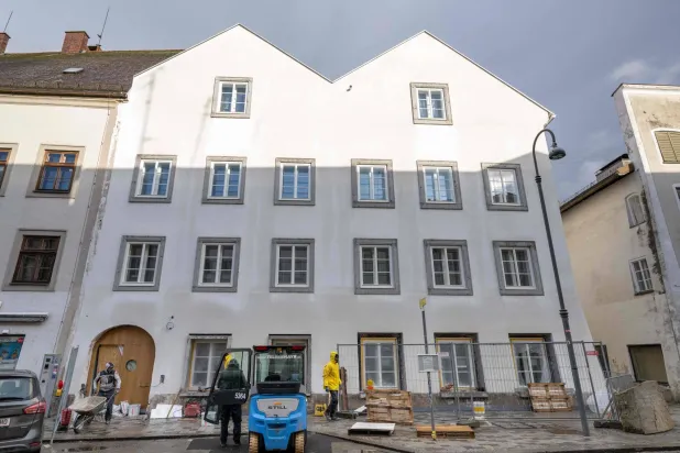 Workers are finishing works at the birth house of former German dictator Adolf Hitler that is turned into a police station, pictured on February 17, 2026 in Braunau am Inn, Austria. (AFP)