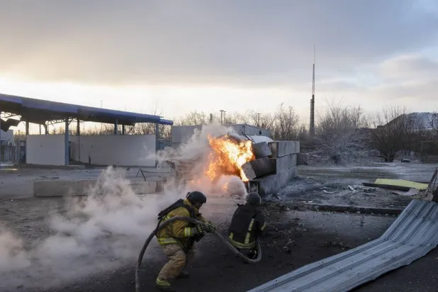 Ukrainian firefighters work at the scene of a recent multiple Russian drone strike on a gas station in Kramatorsk, Ukraine, 09 February 2026. (EPA)