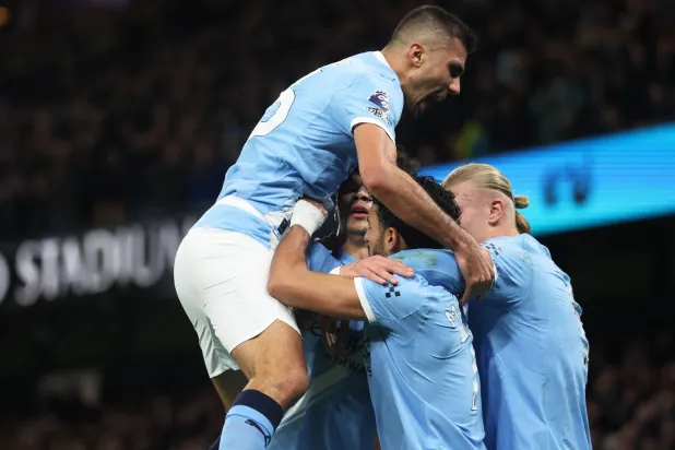 Manchester City players celebrate the second goal (EPA)