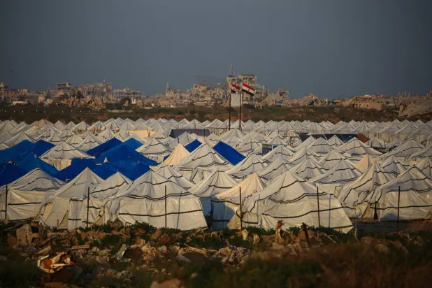 Tents are erected to house displaced Palestinian families in the al-Zahara neighborhood, north of the Nuseirat refugee camp in the central of Gaza Strip on February 21, 2026. (Photo by Eyad Baba / AFP)