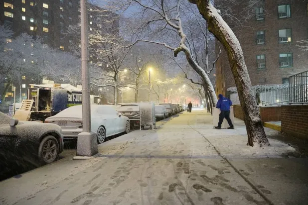 A man works in a snowstorm, Sunday, Feb. 22, 2026, in New York. (AP)