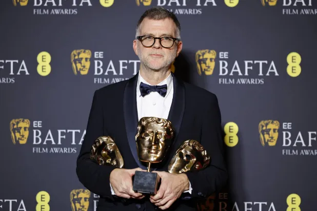 Director Paul Thomas Anderson poses in the press room after winning the awards for Best Film, Best Adapted Screenplay, and Best Director for "One Battle After Another" during the EE BAFTA Film Awards 2026 at the Royal Festival Hall in London, Britain, 22 February 2026. (EPA)