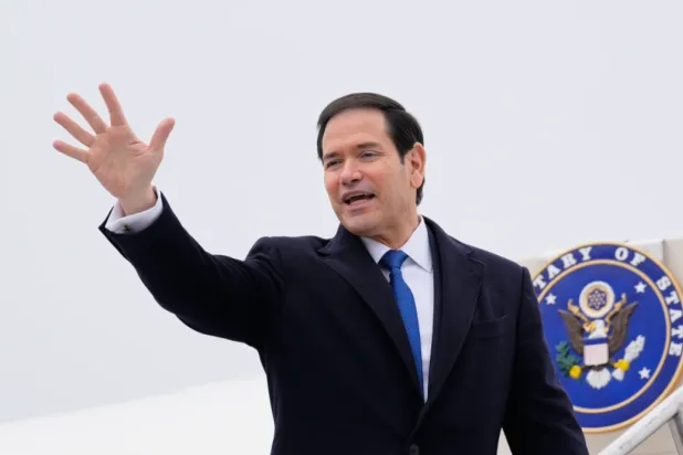 US Secretary of State Marco Rubio waves as he departs at the Liszt Ferenc International Airport in Budapest, Hungary, Monday, Feb. 16, 2026. (AP Photo/Alex Brandon, Pool)

