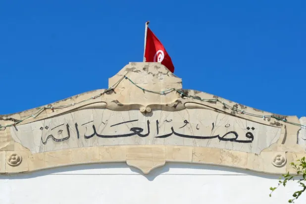 The Tunisian flag flies over the Palace of Justice building in the capital, Tunis, on May 13, 2024 (Reuters).