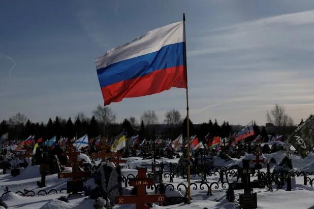 Flags fly over graves, including those of Russian soldiers killed during the conflict against Ukraine, on the eve of the fourth anniversary of the start of Russia’s military campaign, at Lemeshovo cemetery in the Moscow region, Russia, February 23, 2026. (Reuters)