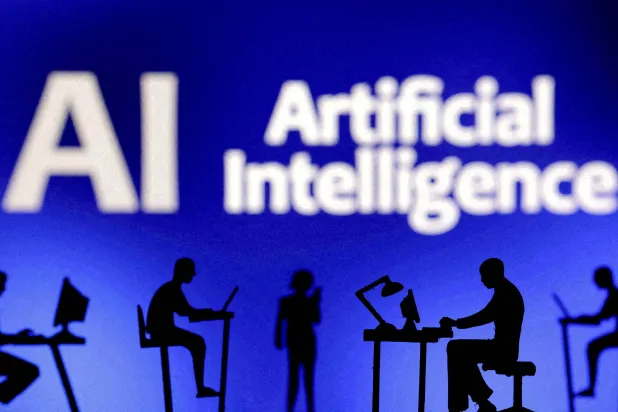 FILE PHOTO: Figurines with computers and smartphones are seen in front of the words "Artificial Intelligence AI" in this illustration taken, February 19, 2024. REUTERS/Dado Ruvic/Illustration/File Photo