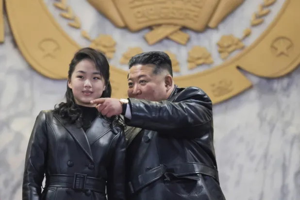 25 February 2026, North Korea, Pyongyang: North Korean leader Kim Jong-un (R), alongside his daughter, Ju-ae, attend a military parade at Kim Il Sung Square in Pyongyang, to mark the ninth congress of the ruling Workers' Party, in this photo released by Korean Central News Agency the next day. Photo: -/YNA/dpa